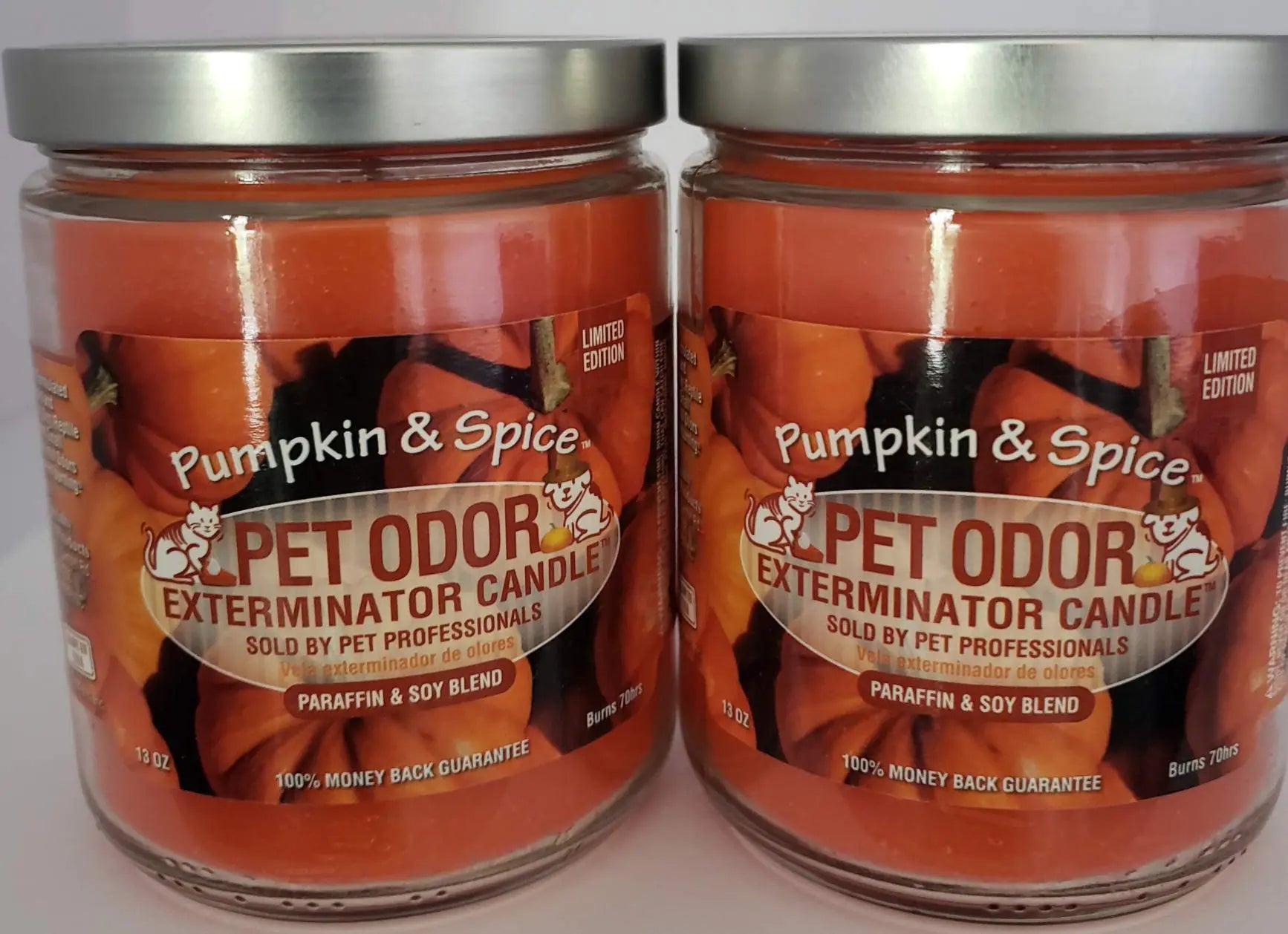 Two jars of 'Pumpkin & Spice Pet Odor Exterminator Candle' on a white background