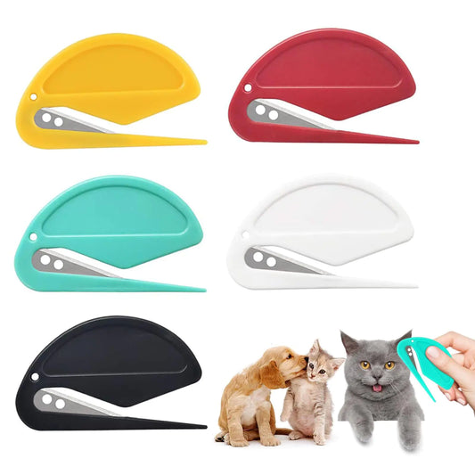 Set of pet grooming tools in various colors with a hand holding a teal tool.